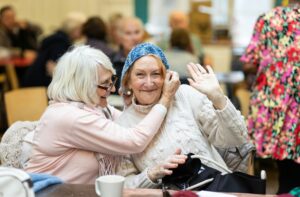 Two women talking and laughing together