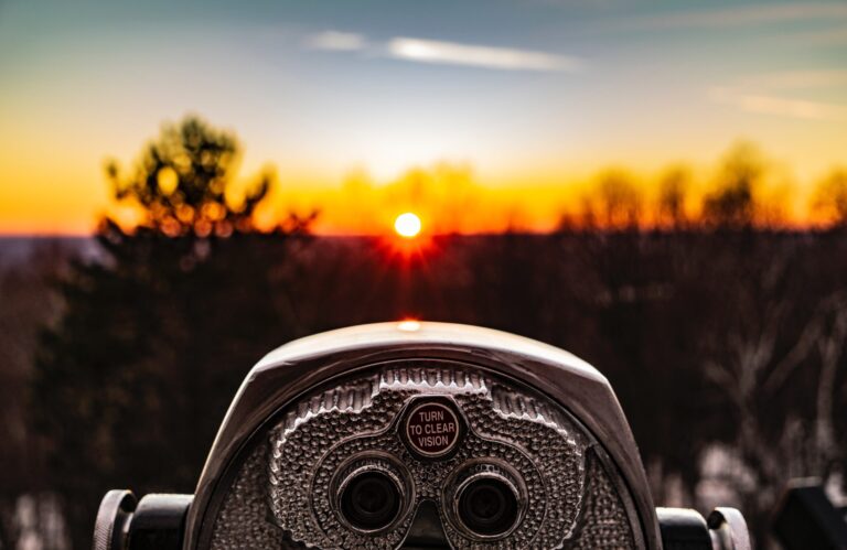 Binoculars focusing towards the horizon