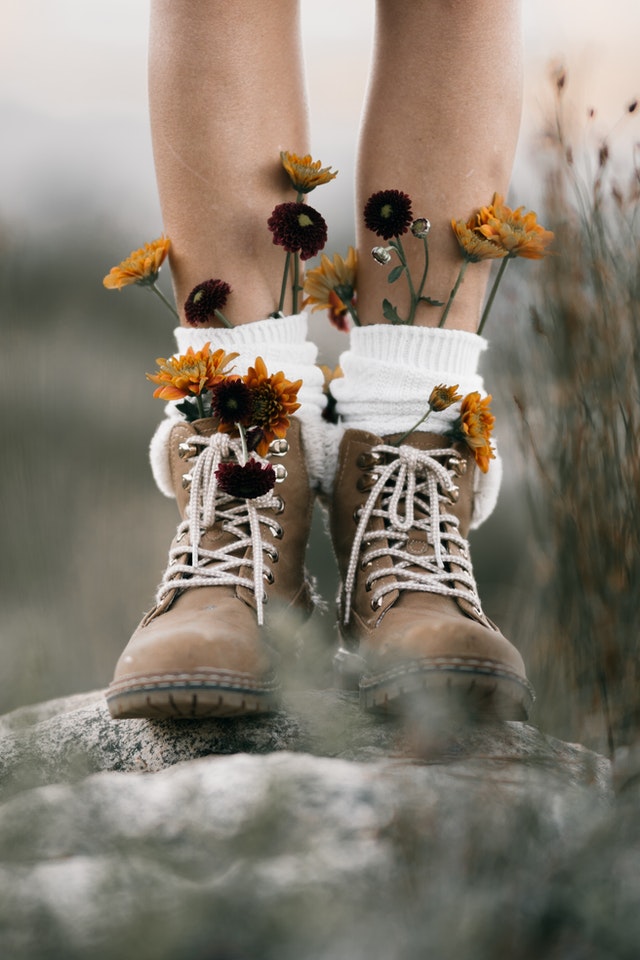 feet with big shoes and flowers